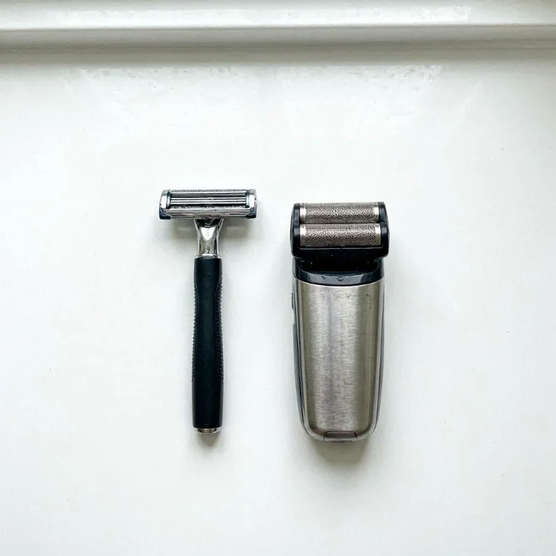a cartridge razor and an electric shaver placed side‑by‑side for comparison