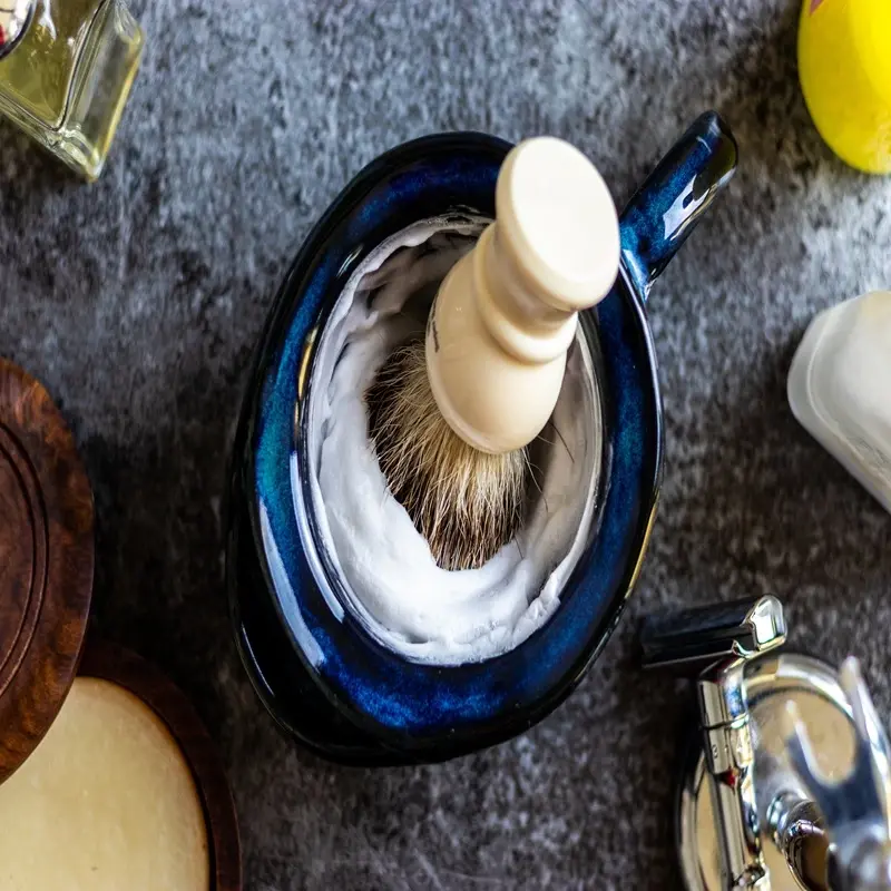 shaving lather in bowl with a shaving brush foam texture grooming